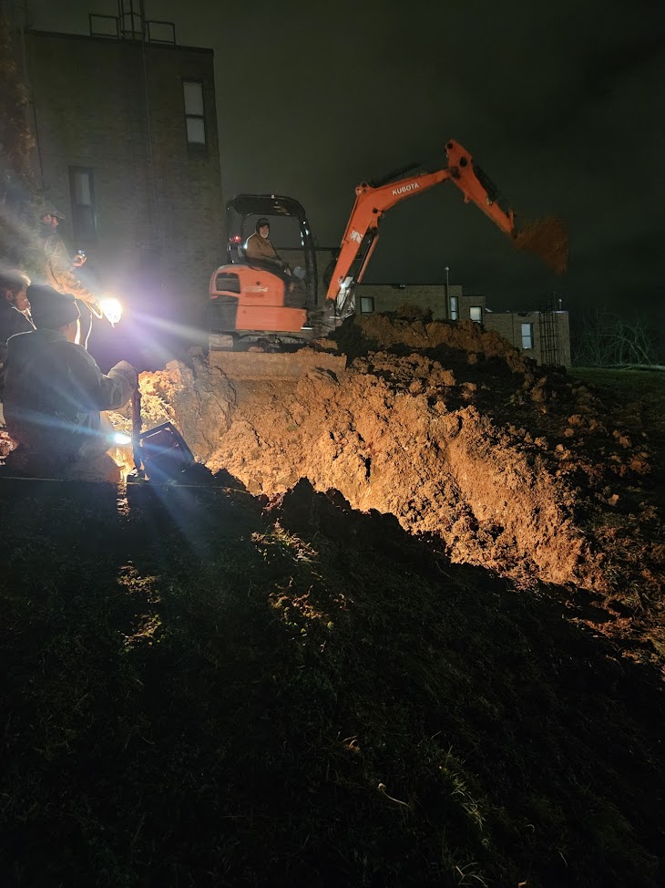 Excavation in progress during a sewer line repair by Buckner Plumbing